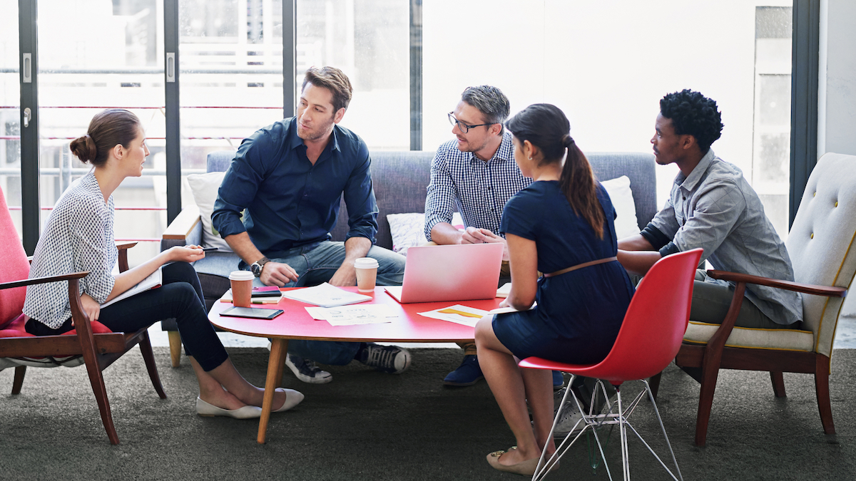 business people sitting at a table to discuss talent acquisition