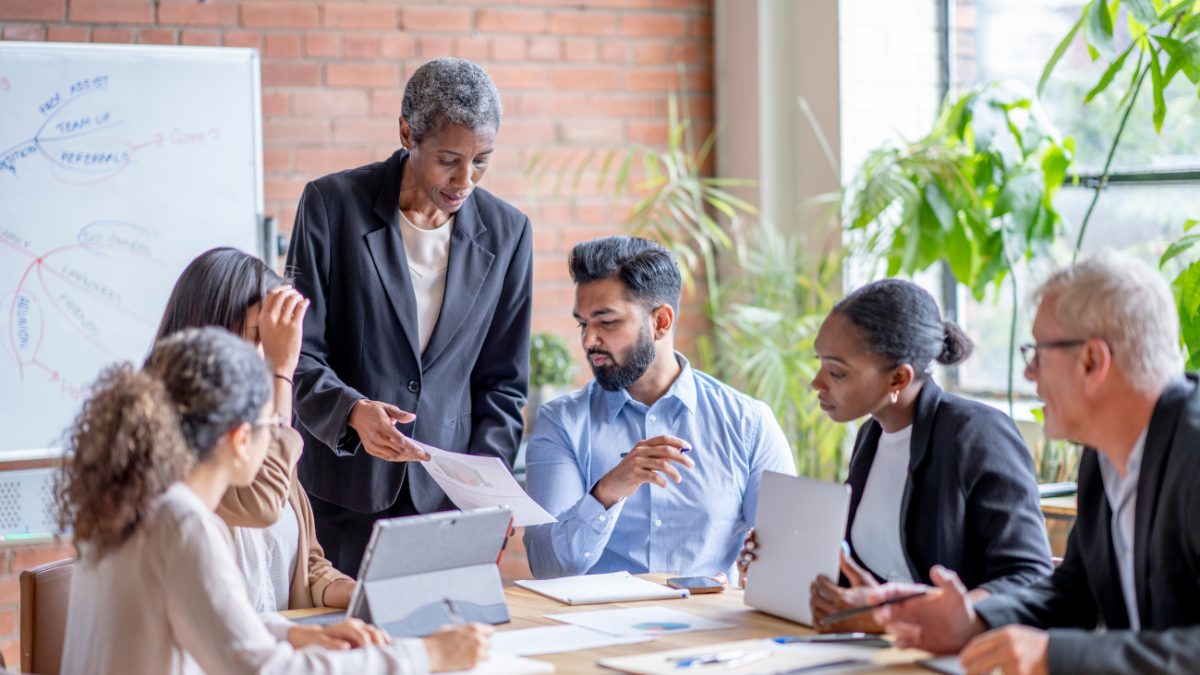 People sitting around a conference table discussing change