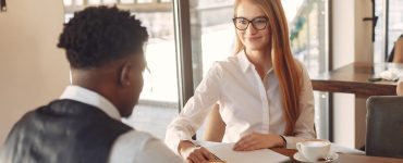 Job applicant being asked behavioral interview questions by an interviewer